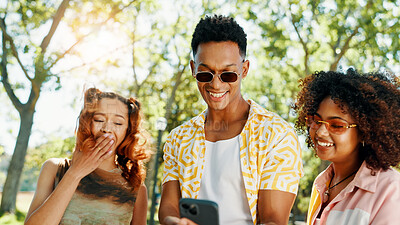 Buy stock photo Smartphone, holiday and friends laughing in park for celebrity gossip, online blog or mobile app. Happy, social networking and people with technology browsing media for funny post outdoor in nature