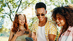Friends, laughing and reading phone at park for social media meme, online gossip and funny internet news. Gen z people, happy and smartphone for dating app chat, text notification and show message