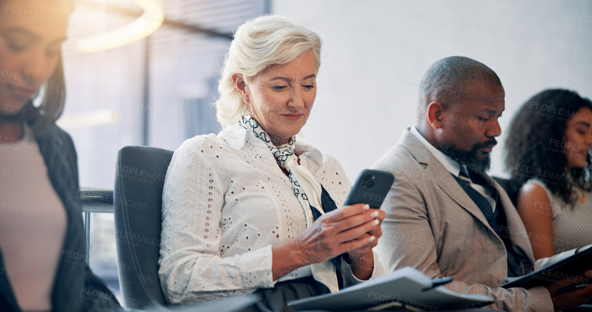 Buy stock photo Business, waiting room and mature woman with phone, texting and smile for message on social media. Office, typing and communication with contact for job recommendation, people and chat with mobile