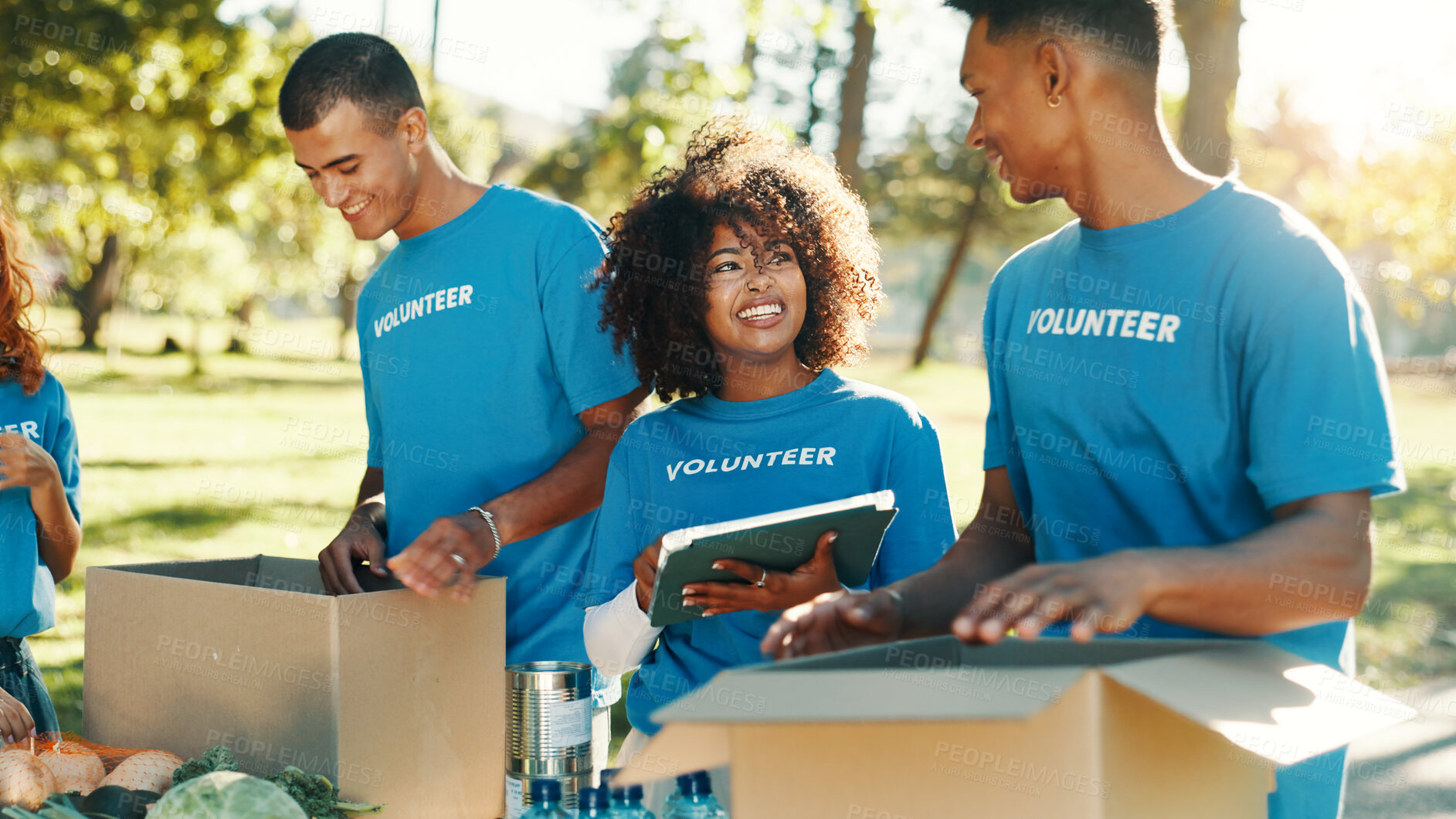 Buy stock photo People, volunteer and boxes of charity at park for giving food, packing supplies and community aid. Staff, tablet and sorting products with donation outreach, teamwork and distribution of NGO welfare