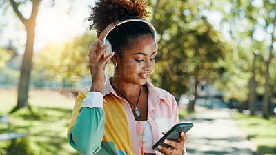 Buy stock photo Park, woman and smile with mobile for headphones, audio track and check location on vacation outdoor. Nature, African female person and tourist with smartphone for travel application, music and happy