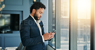 Buy stock photo Business, man and phone by window in office for research, communication and financial planning. Male accountant, mobile and reading email of investment feedback, schedule update and audit negotiation