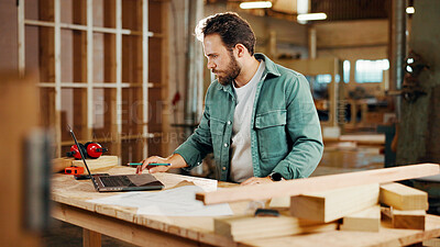 Buy stock photo Carpenter, laptop and plans with wood to measure for construction, furniture or project. Woodworker, person and plank with blueprint in creative carpentry workshop for manufacturing, art and craft