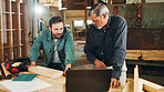 Woodwork, carpenter or people on laptop in warehouse for factory, check inventory or furniture production. Research, carpentry and online update for timber supply, lumber and construction business