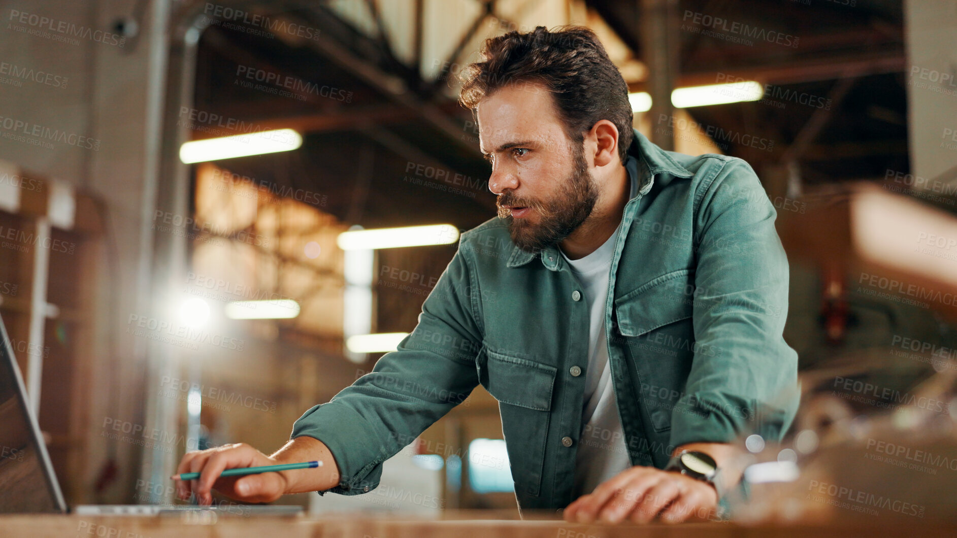 Buy stock photo Laptop, planning and research with carpenter man in workshop for manufacturing or production. Carpentry computer and construction with professional contractor in factory to review online blueprints