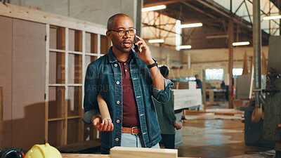 Buy stock photo Phone call, carpenter and man in workshop, talking and communication for update of project or tech. Manufacturing, craftsman and black person in business for woodwork, furniture and chat with contact