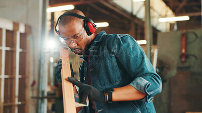 Buy stock photo Carpenter, check and sanding wood for construction, furniture or renovation project planning. Woodworker, black man and plank with tools in creative carpentry workshop for manufacturing, art or craft