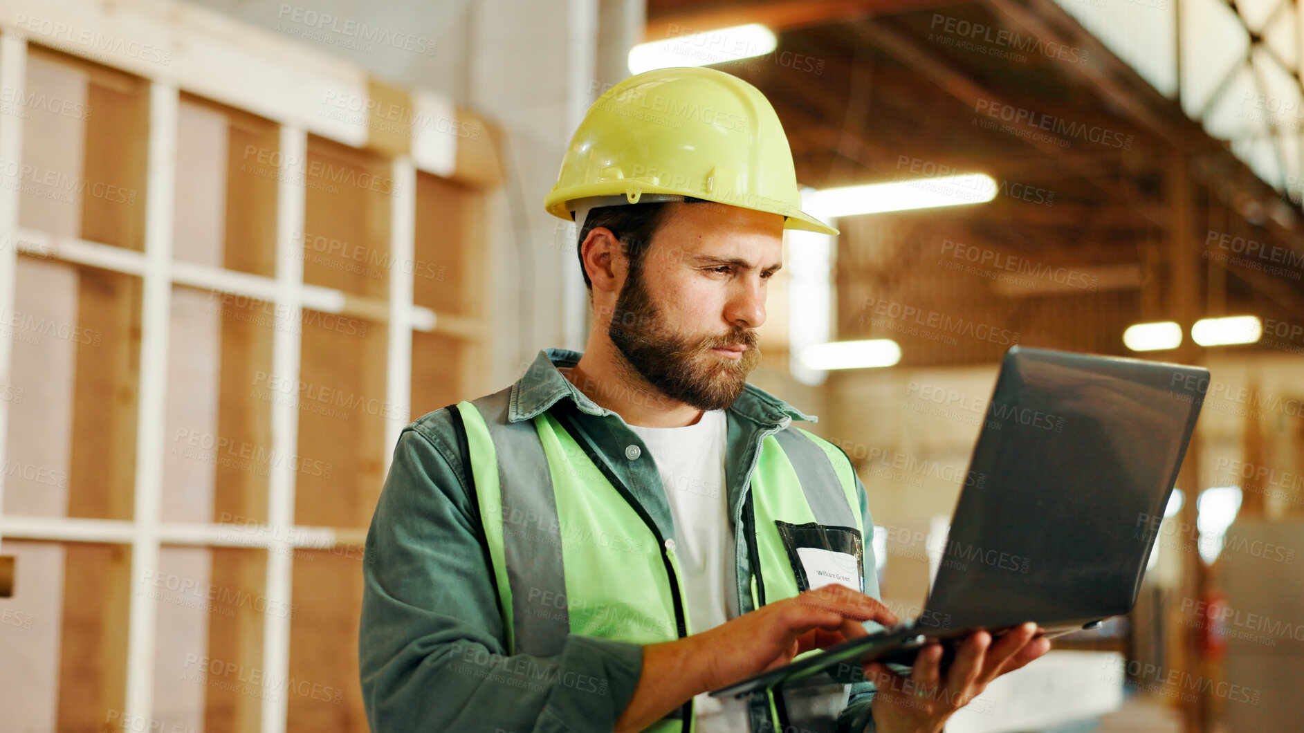 Buy stock photo Engineer, man and carpenter with laptop for construction, manufacturing or furniture production. Person, carpentry and computer in factory for building, woodwork design or serious for problem solving