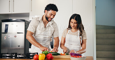 Buy stock photo Smile, vegetables and cooking with couple in kitchen for health, food and recipe. Love, bonding and nutrition ingredients with man and woman helping at home for meal prep, wellness and lunch menu