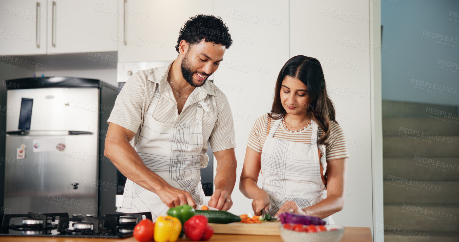Buy stock photo Smile, vegetables and cooking with couple in kitchen for health, food and recipe. Love, bonding and nutrition ingredients with man and woman helping at home for meal prep, wellness and lunch menu