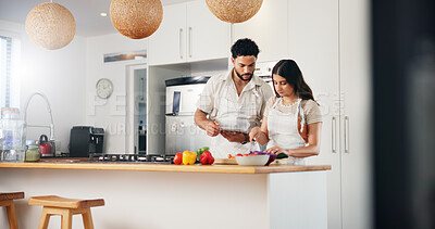 Buy stock photo Tablet, food and cooking with couple in kitchen for health, vegetables and online recipe. Love, bonding and nutrition ingredients, man and woman helping at home for meal prep, wellness and lunch menu