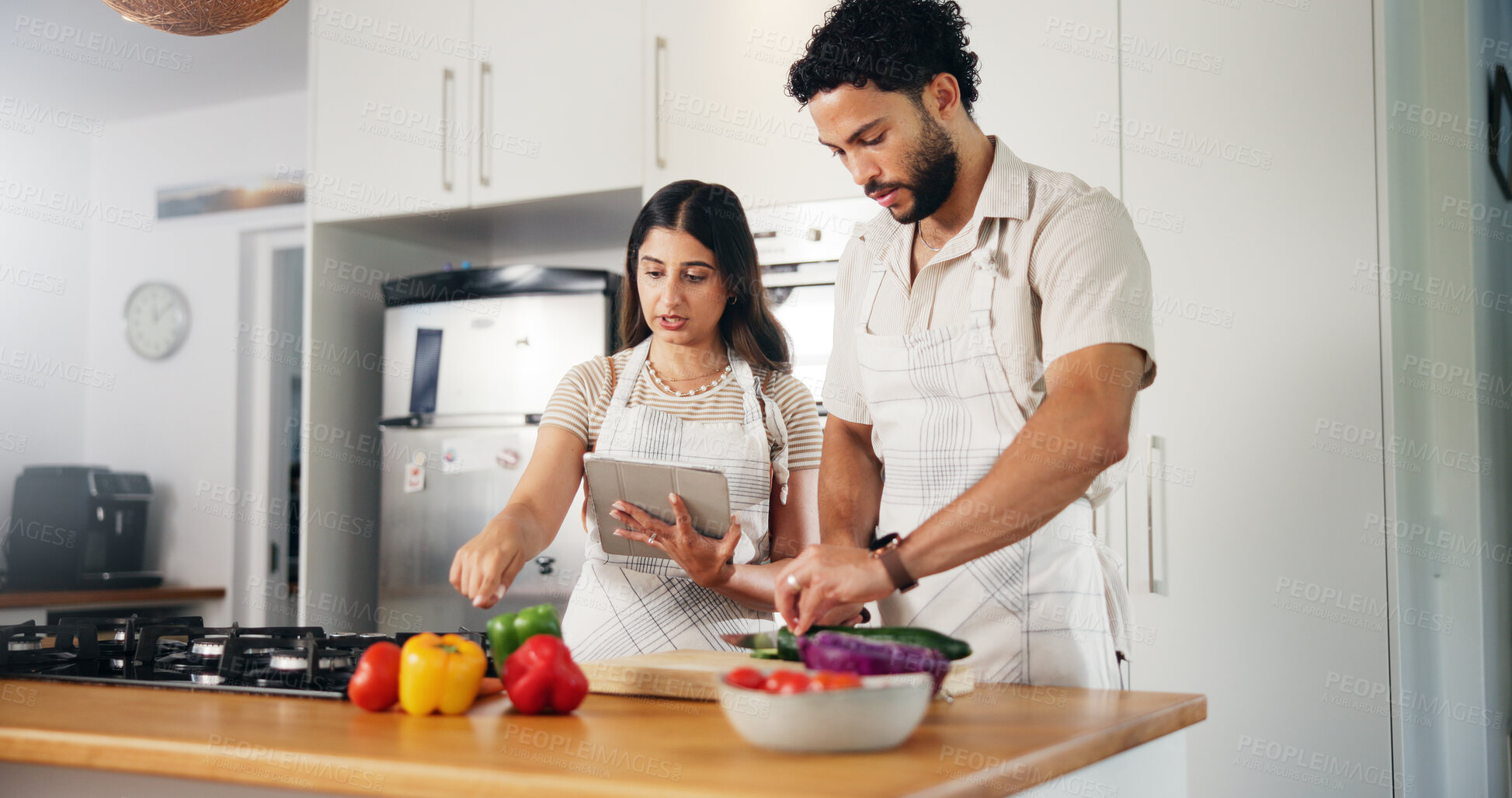 Buy stock photo Couple, vegetables or cooking with tablet in kitchen for online recipe, meal instructions or reading tutorial. People, food blog or cutting ingredients for healthy dinner or internet guidance in home