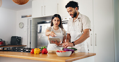 Buy stock photo Couple, cooking and tablet with online recipe in kitchen for meal instructions, tutorial guidance or support. People, food blog or cutting ingredients for healthy dinner or nutrition website in home
