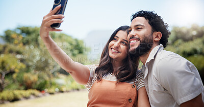 Buy stock photo Couple, happy and selfie in nature for date, love and social media update at anniversary picnic. Man, woman and travel in park for photography, bonding and making memories on weekend in marriage