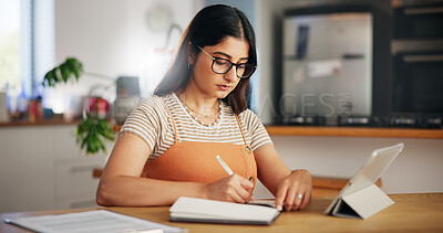Buy stock photo Tablet, remote work and woman writing notes in home for online research or content writer with story ideas. Digital technology, serious freelancer or notebook for copywriting, article or social media