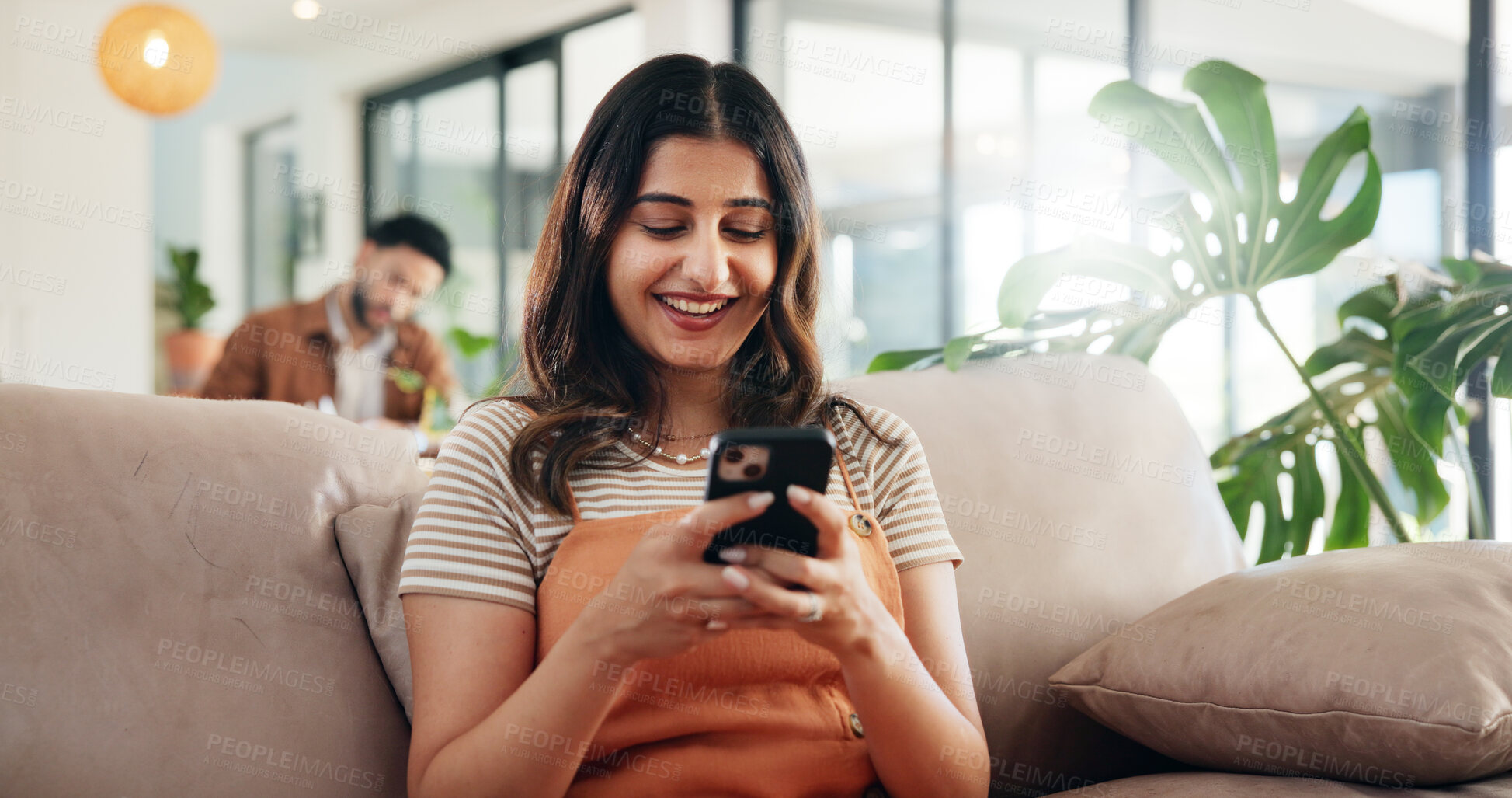 Buy stock photo Home, smile and woman on sofa, smartphone and internet with connection, social media and texting. Person, apartment and girl on couch, cellphone and mobile user with message to contact, app and email