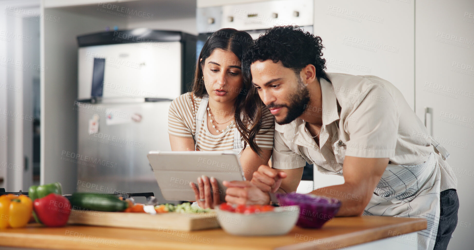 Buy stock photo Couple, tablet or cooking with video in home for online recipe, dinner instructions or watching tutorial. People, food blog or vegetable ingredients for healthy lunch or internet guidance in kitchen