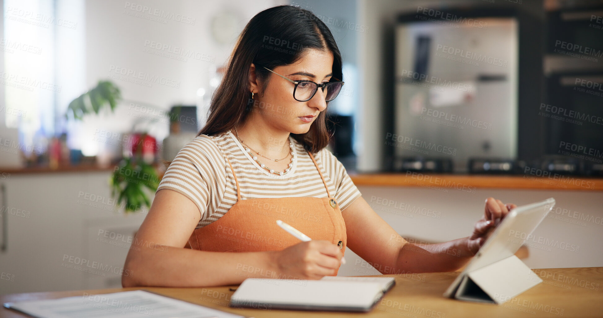 Buy stock photo Tablet, freelancer and woman writing notes in home for online research or content writer with story ideas. Digital technology, serious or scroll on internet for copywriting, notebook or remote work