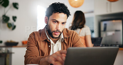 Buy stock photo Search, laptop and remote work with man in kitchen for research, blog writer and news post. Entrepreneur, freelancer and online feedback with person at home for media update, startup and planning