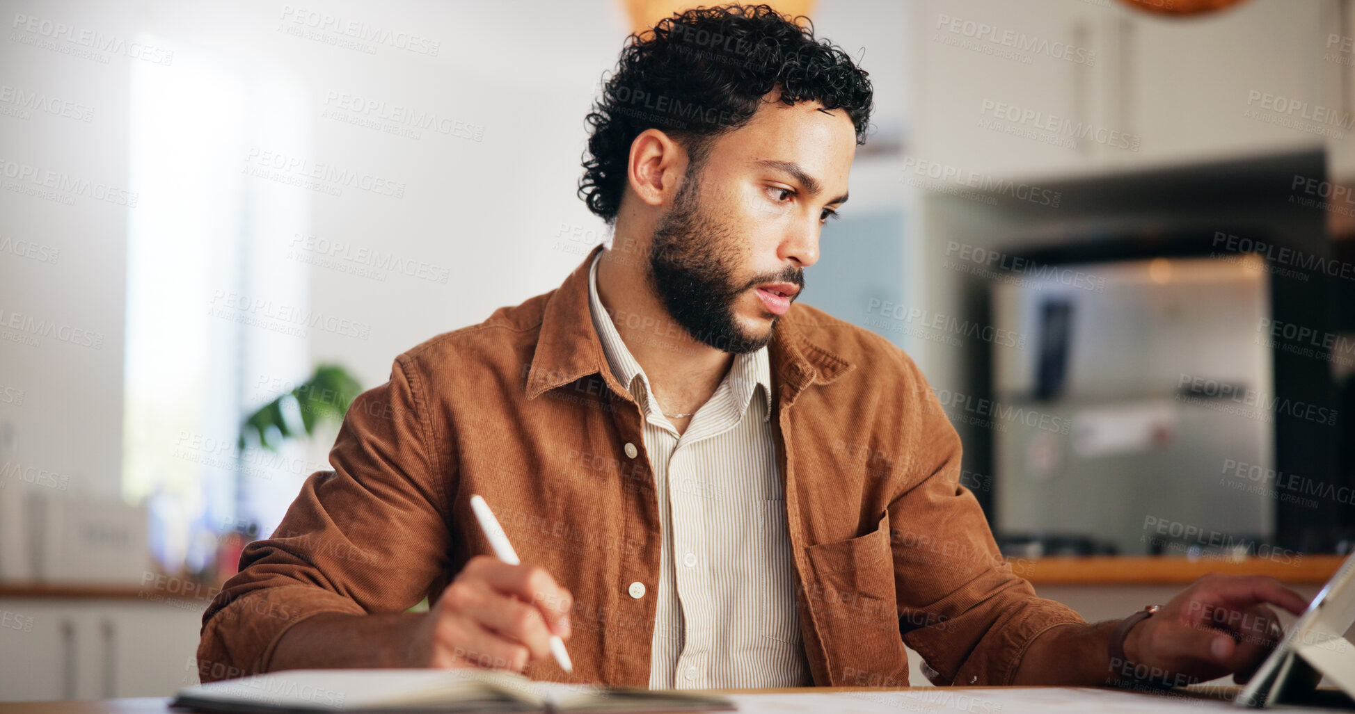 Buy stock photo Tablet, reading and remote work with man in kitchen for research, blog writer and news post. Entrepreneur, freelancer and online feedback with person at home for media update, startup and planning