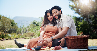 Buy stock photo Date, picnic and romantic with couple in park together for bonding, eating food or relationship. Anniversary, hugging or love with man and woman outdoor in nature for valentines day celebration