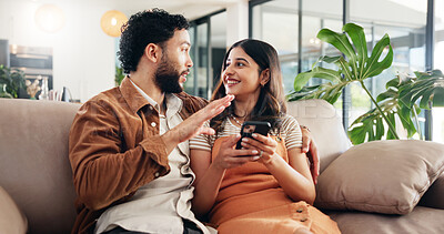 Buy stock photo Home, conversation or couple on sofa, cellphone or love with social media, chatting or relationship. Digital app, man or woman on couch, smartphone or email notification with marriage and talking