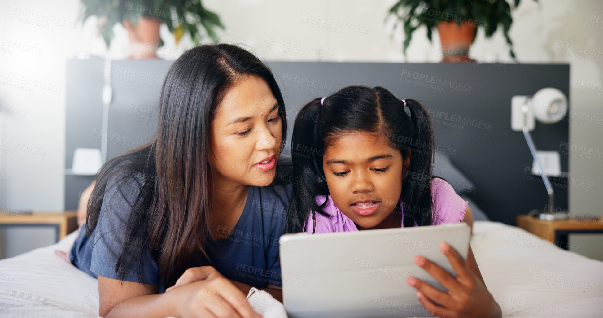 Buy stock photo Mother, kid and relax with tablet on bed for playing online game, streaming service or reading ebook. Family, woman and girl child with digital app in home for watching cartoon, connection or bonding