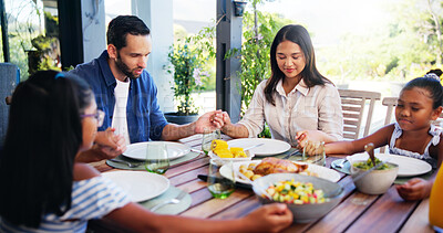 Buy stock photo Praying, family and gratitude for meal, home and holding hands with children for faith or religion. House, people and parents with kids in morning, worship or praise for food, mom and dad with belief