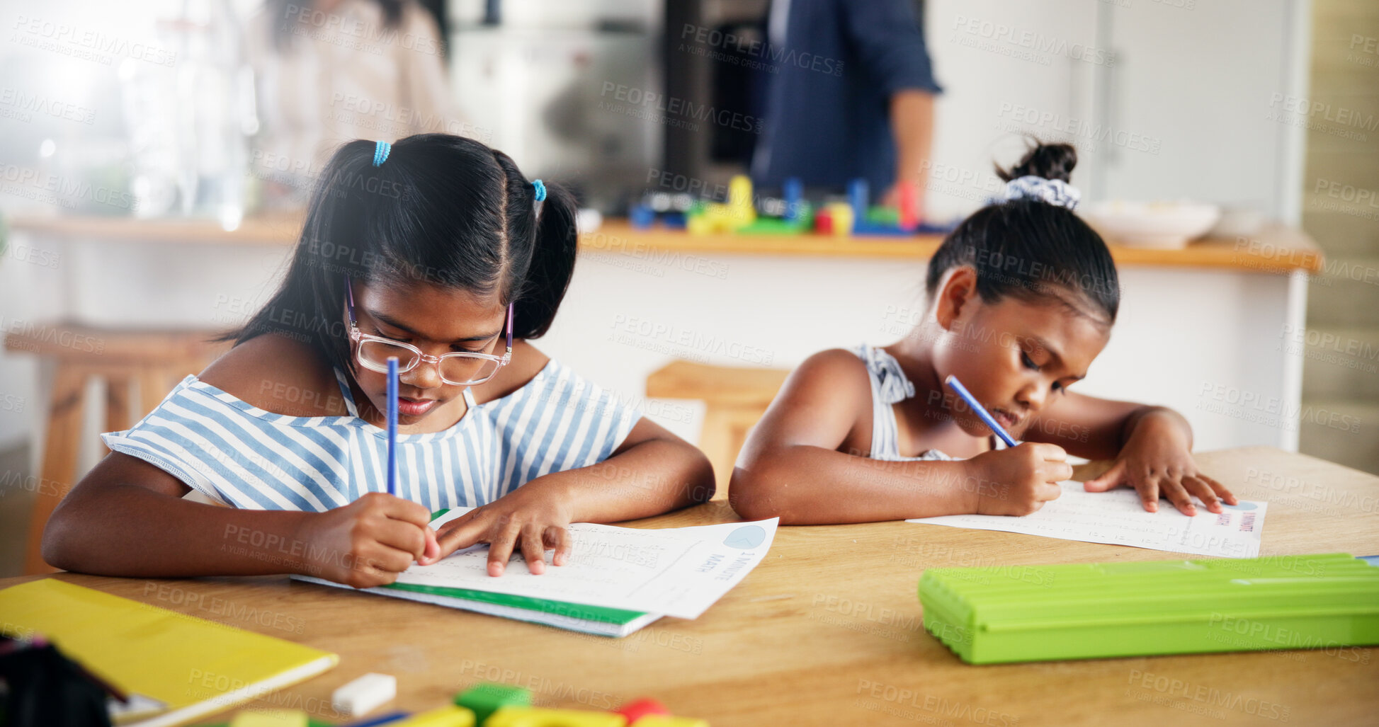 Buy stock photo Education, writing and children with homework in house for learning, studying or development. Knowledge, student and girl kids practicing for school assessment, test or assignment in book by table.