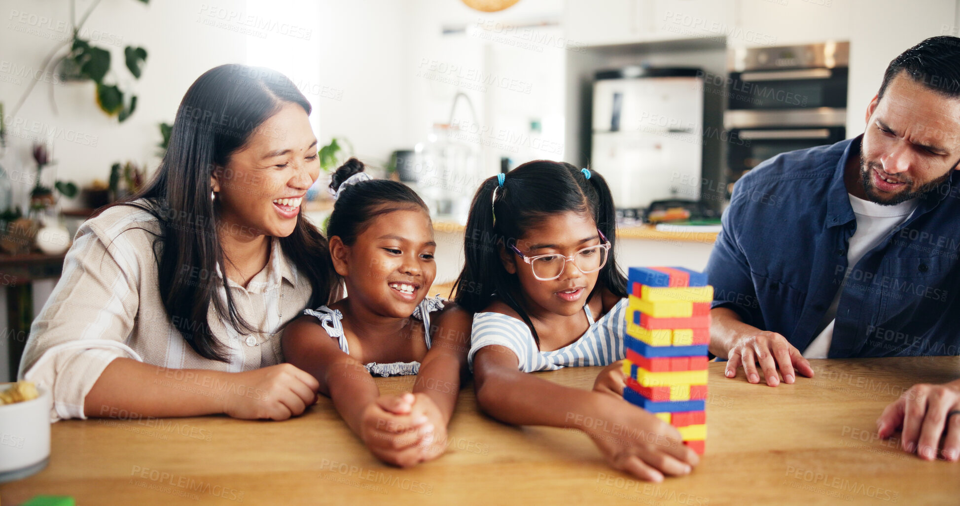 Buy stock photo Home, parents and game with toys for children, cognitive development and bonding together as family. Kitchen, mother and father with kids for puzzle blocks, playing and creativity with logic in house