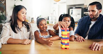 Buy stock photo Home, parents and game with toys for kids, cognitive development and bonding together as family. Kitchen, mother and father with children for puzzle blocks, playing and creativity with logic in house