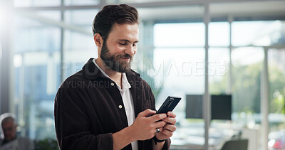 Buy stock photo Smile, creative and business man with mobile in office for networking, typing text or social media marketer online. Phone, startup and worker reading email, campaign and brand promotion on platform