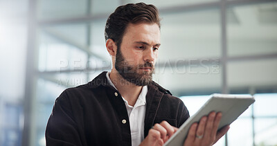 Buy stock photo Scroll, creative and business man with tablet in office for networking or social media marketer online. Technology, startup and serious worker reading email, campaign and brand promotion on platform