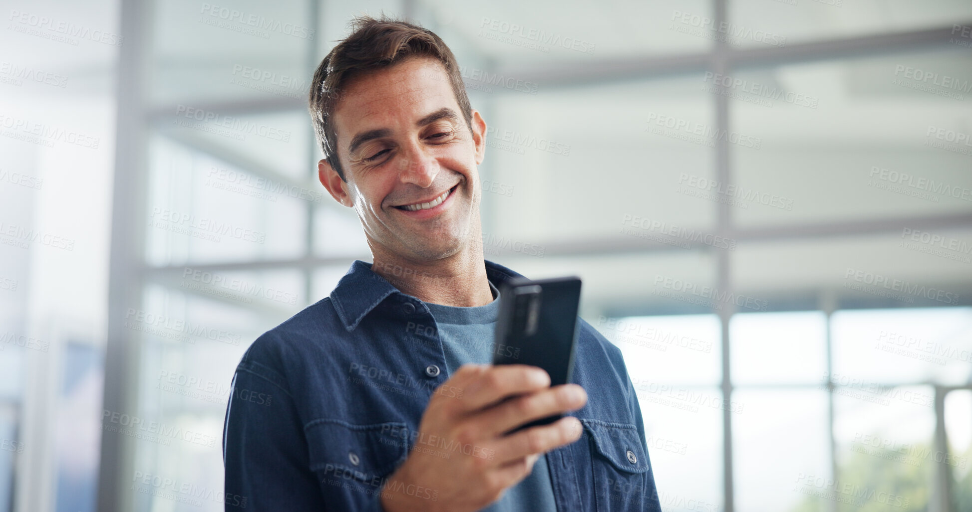 Buy stock photo Smile, office and business man with smartphone for networking, typing and social media marketer online. Mobile, startup and creative worker reading email, campaign and brand promotion on platform