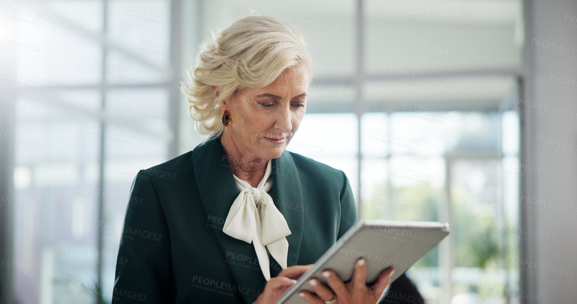 Buy stock photo Office, businesswoman and mature with tablet for reading, review email or lawyer for justice solution. Tech, female person or corporate attorney with research for problem solving, court case or trial