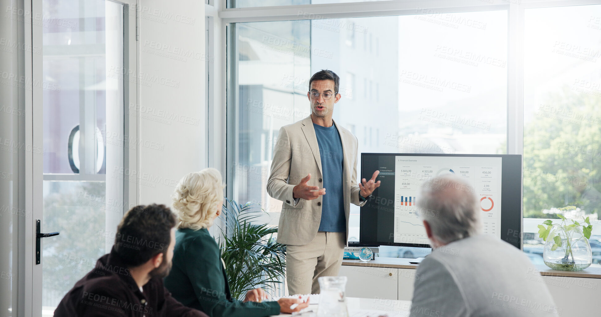 Buy stock photo Presentation, discussion and businessman in office with team for company profit, revenue or dividend. Meeting, professional and financial manager with group of investors for investment planning.