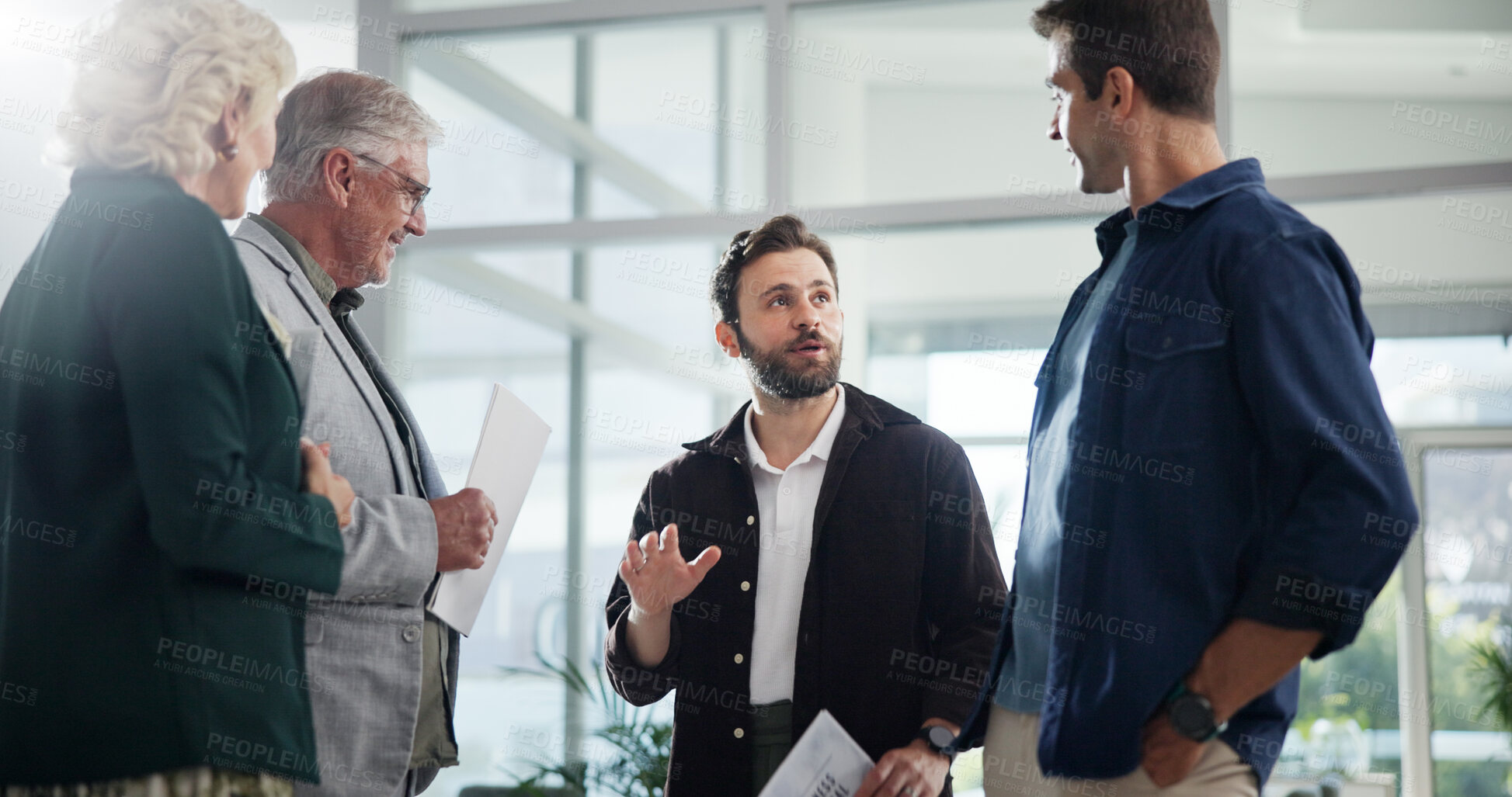 Buy stock photo Lobby, conversation and business people in meeting, planning and share ideas with cooperation. Employees, coworking and group in hallway, collaboration and communication with advice and feedback