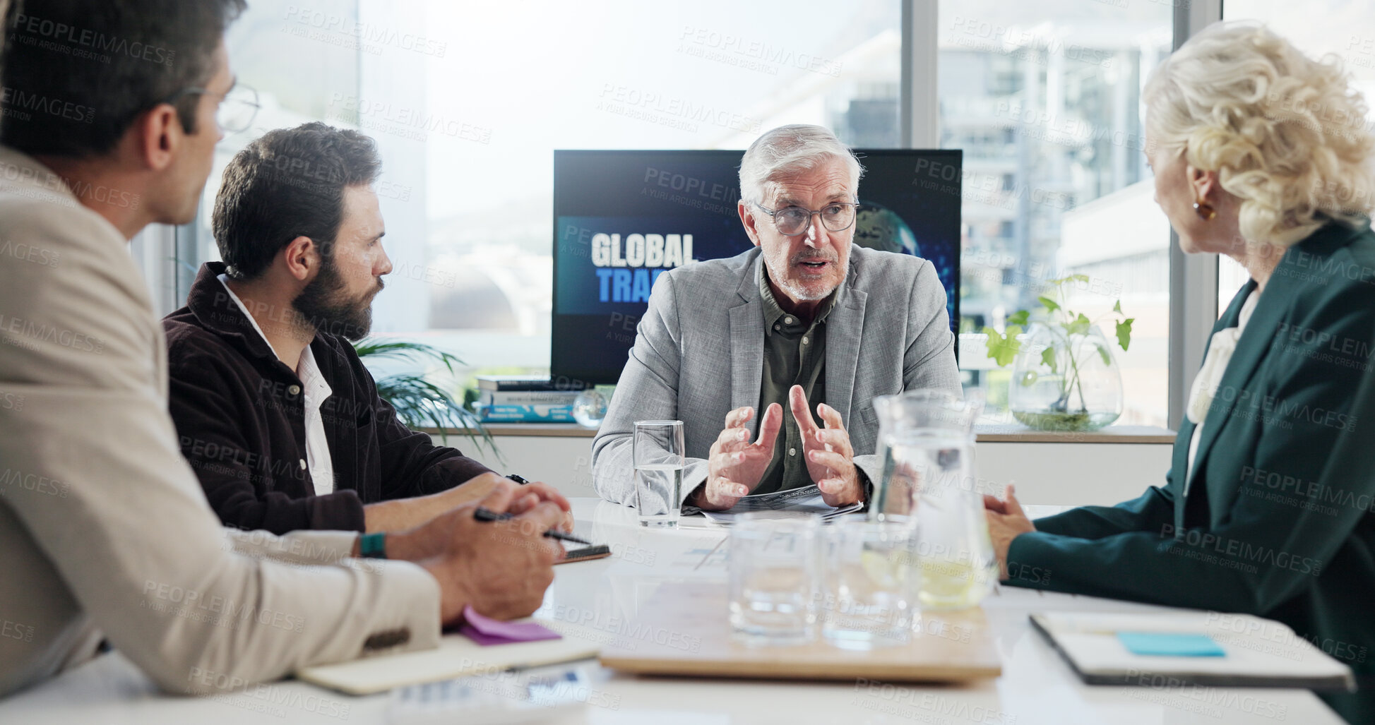 Buy stock photo Discussion, boss and group meeting in boardroom, serious and communication for global trade. Team, mature man and negotiation for international investment, people and economic trends in business