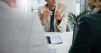 Buy stock photo Office, meeting and businessman with feedback for finance, investment briefing or review proposal. Collaboration, employees and financial advisor with corporate paper for discussion, report or laptop
