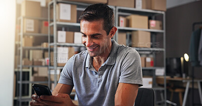 Buy stock photo Phone, smile and supply chain with man in distribution center for communication or text message update. Boxes, logistics and typing with happy employee in office for delivery, ecommerce or shipping