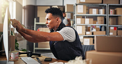 Buy stock photo Logistics, warehouse and man with computer, plan and checking schedule on sticky notes or small business. Reading, entrepreneur and person with info for delivery, stock and planning for online store