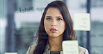 Thinking, glass board and businesswoman in office for company investment planning. Brainstorming, research and female financial manager writing by wall for corporate finance proposal in workplace.