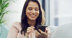 Woman, happy and relax with phone on sofa for social media scroll, streaming service or chat on dating site. Smile, person and smartphone in home for text message, app download and web subscription