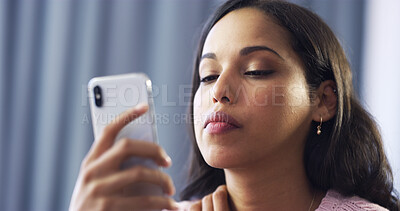 Buy stock photo Home, woman and reading with phone for chat, breakup message or communication with online contact. House, female person or upset with mobile for app, cyberbullying or trolling comment on social media