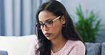 Sofa, woman and glasses with laptop for freelancer, article research and information for editing. Home, remote work and female content writer with spectacles for proofreading, news story and review