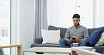 Man, relax and morning with phone on sofa for online communication, texting or chatting at home. Male person, user or typing with mobile smartphone for connection, network or app on living room couch
