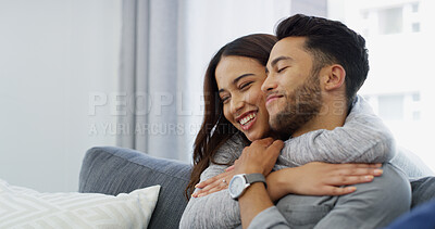 Buy stock photo Smile, love and hug with couple on sofa of home for bonding, support and care. Happiness, commitment and trust with man and woman in living room of apartment peace, relax and relationship romance