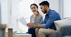 Couple, documents or discussion with finance on sofa for mortage expenses, bills or invoices at home. Man, woman or paperwork with missed payments for financial report, debt or credit review at house