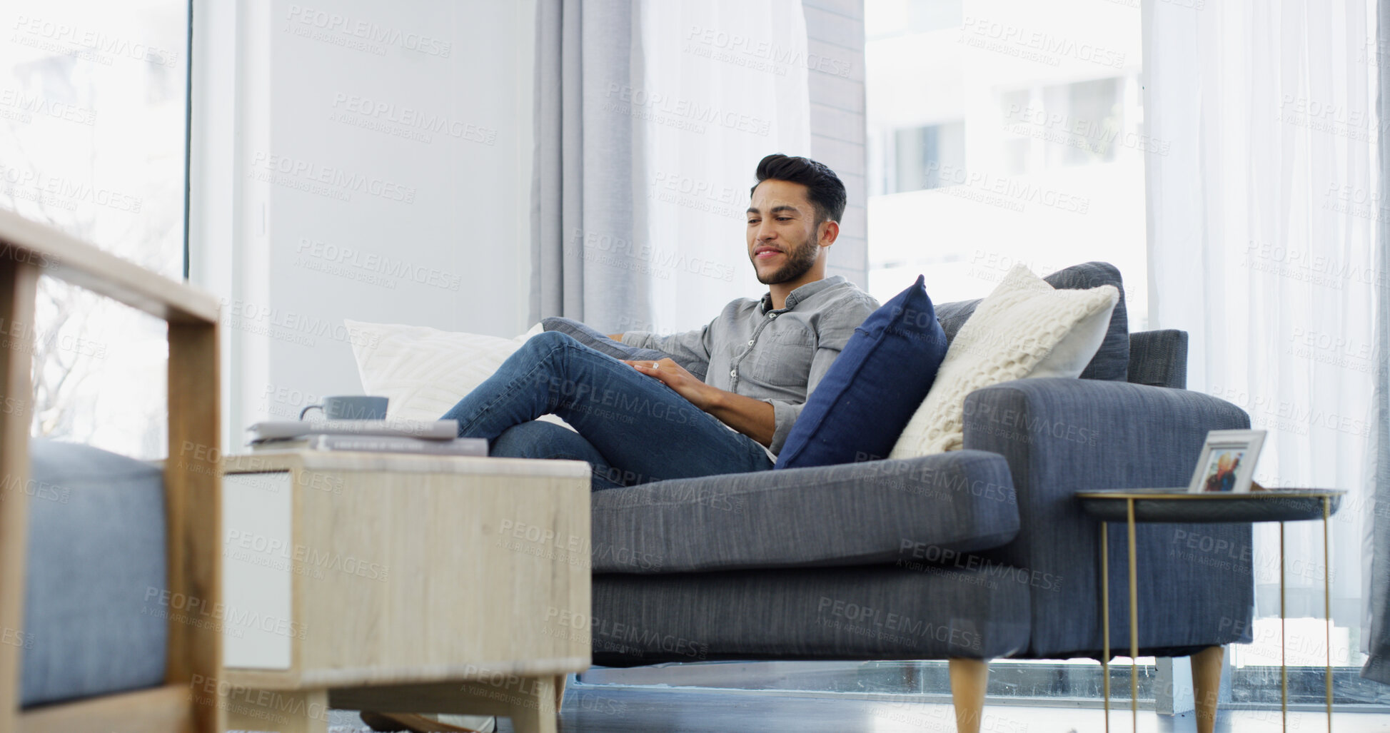 Buy stock photo Smile, man and relax with thinking on sofa for weekend break, nostalgia or happy memory. Peaceful person, thoughtful and daydreaming in living room with reflection, wondering and remember in house