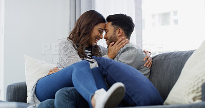 Buy stock photo Forehead, love and cuddle with couple on sofa of home for bonding, support and care. Happy, commitment and trust with man and woman in living room of apartment peace, relax and relationship romance